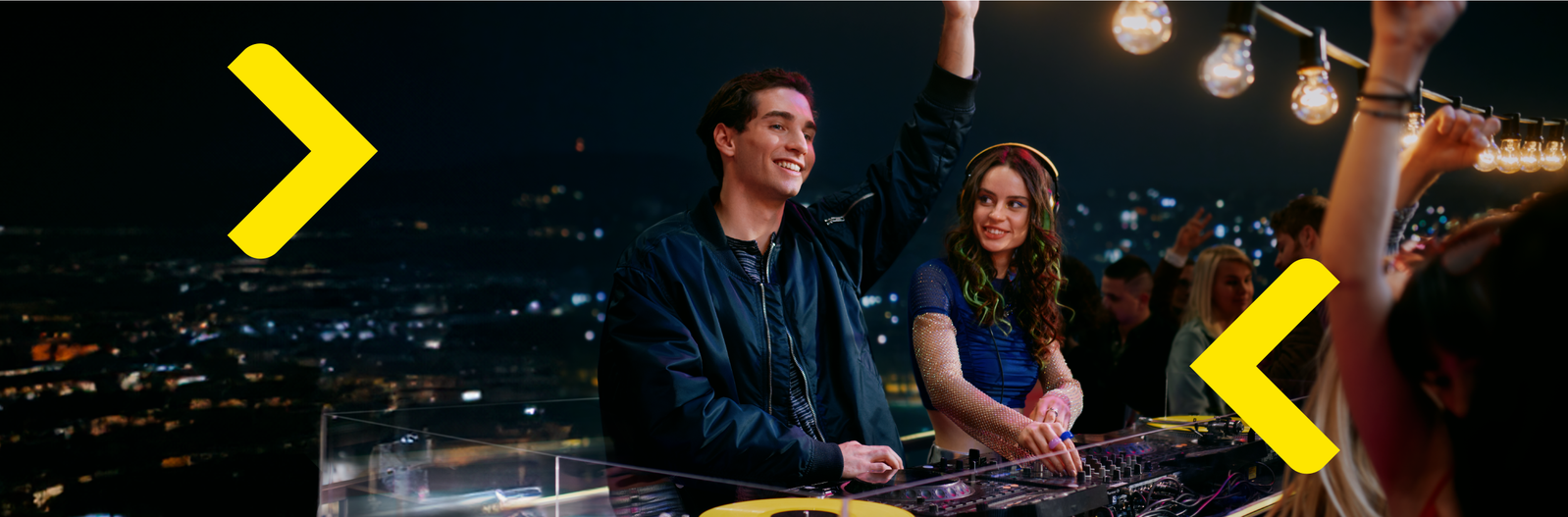 two young people in the dj booth