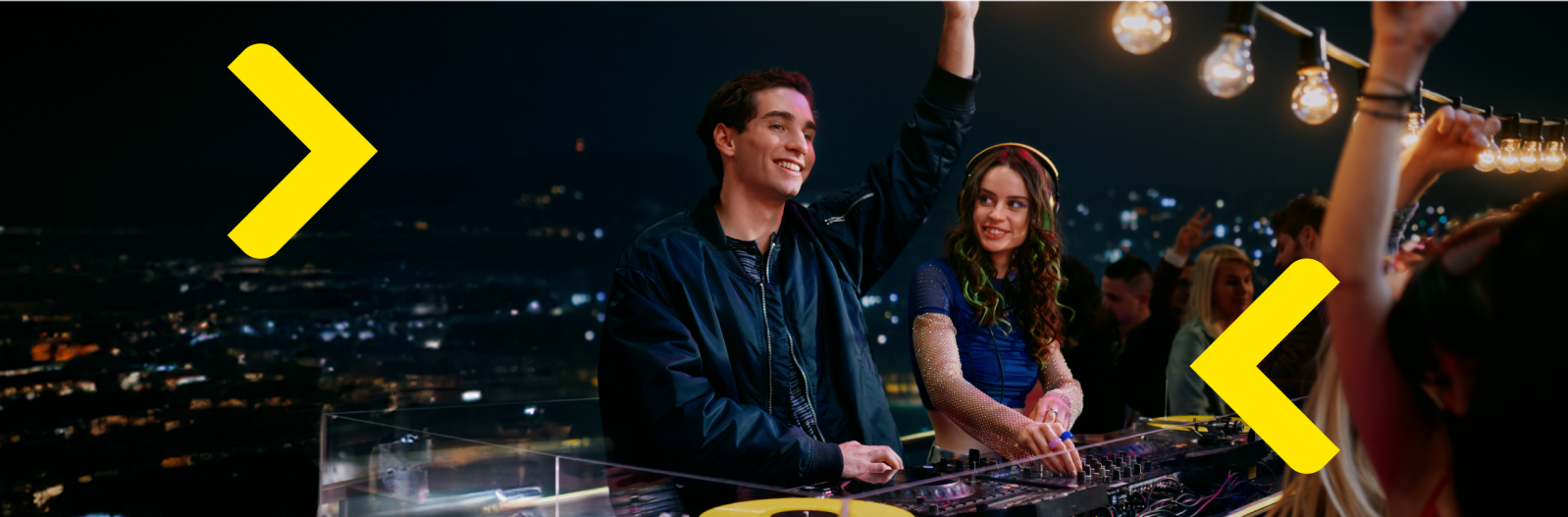 two young people in the dj booth